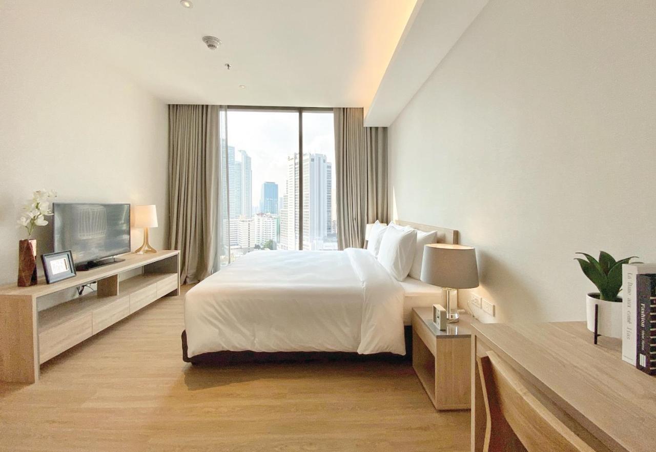 Oakwood Suites Bangkok Eksteriør bilde A bedroom at the hotel